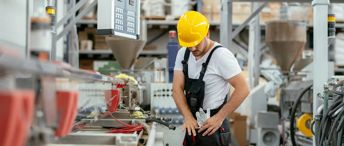 A factory worker operating machinery